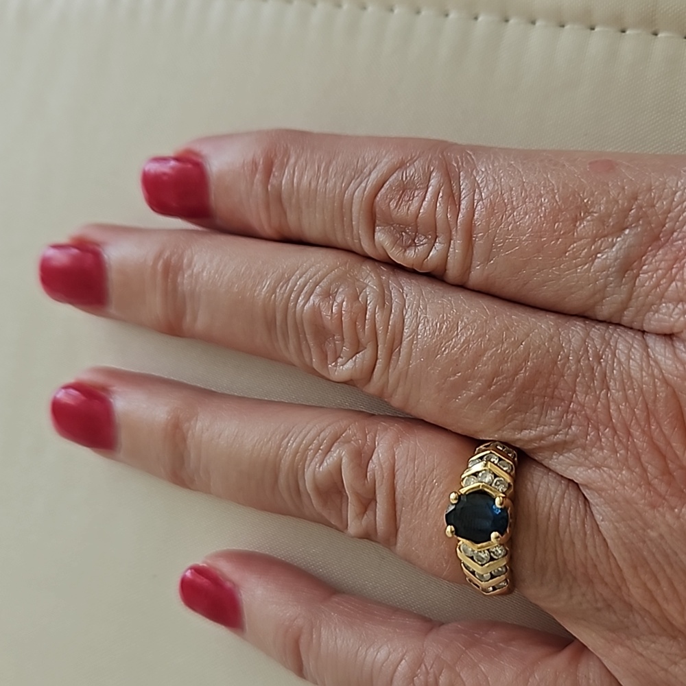 Women's 14kt yellow gold sapphire and diamond ring.